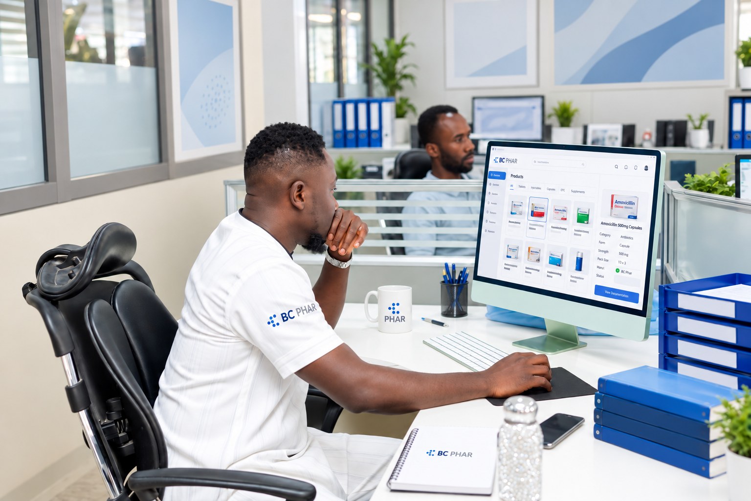 Specialist reviewing a pharmaceutical product management system on screen