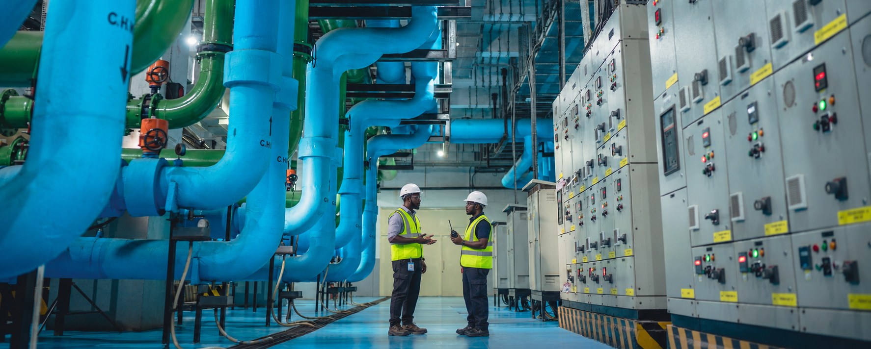 Facility plant room combining chilled water distribution, air systems and electrical switchgear